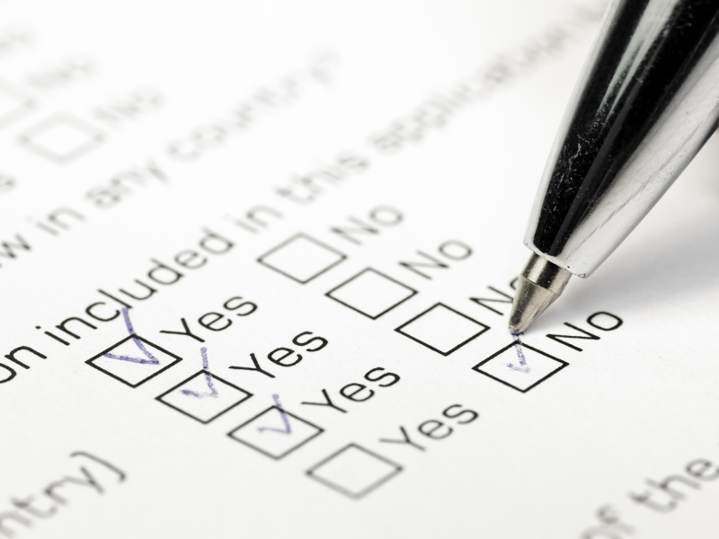 printed survey boxes with yes and no beside them (market analysis post)